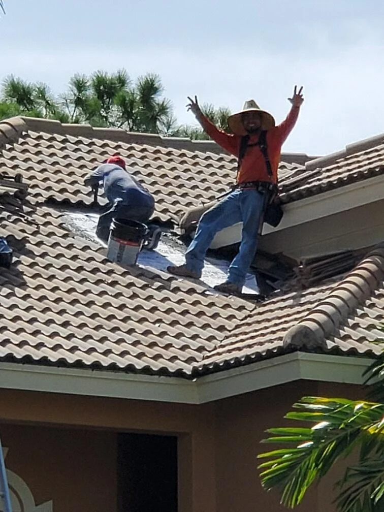 Rooftop Roofing crew working on a Florida tile roof