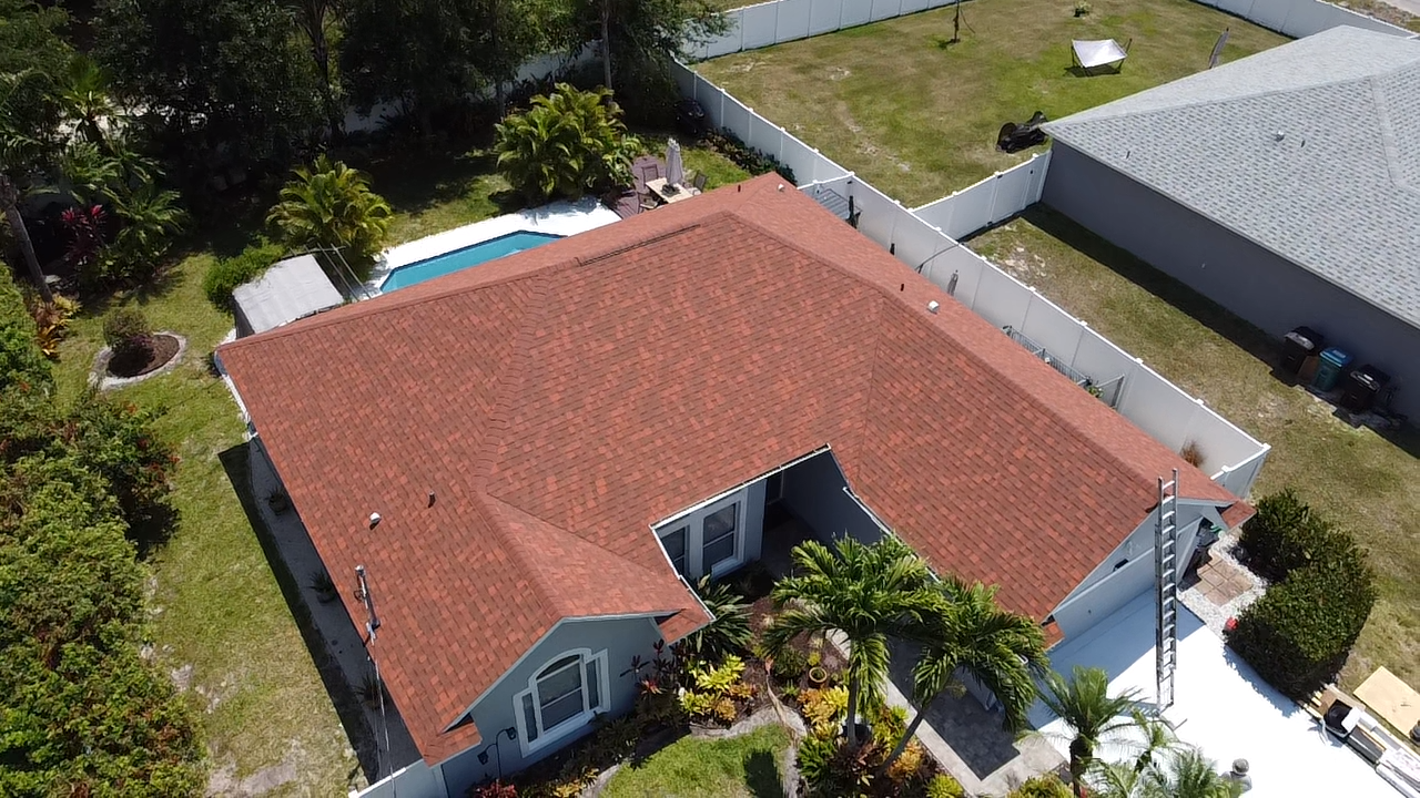 Aerial view of new shingle roof installation by Rooftop Roofing