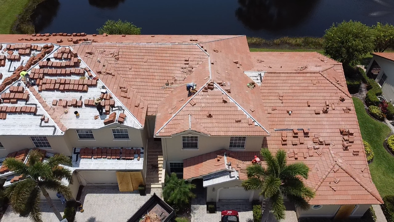 Large tile roof being re-roofed by Rooftop Roofing crew