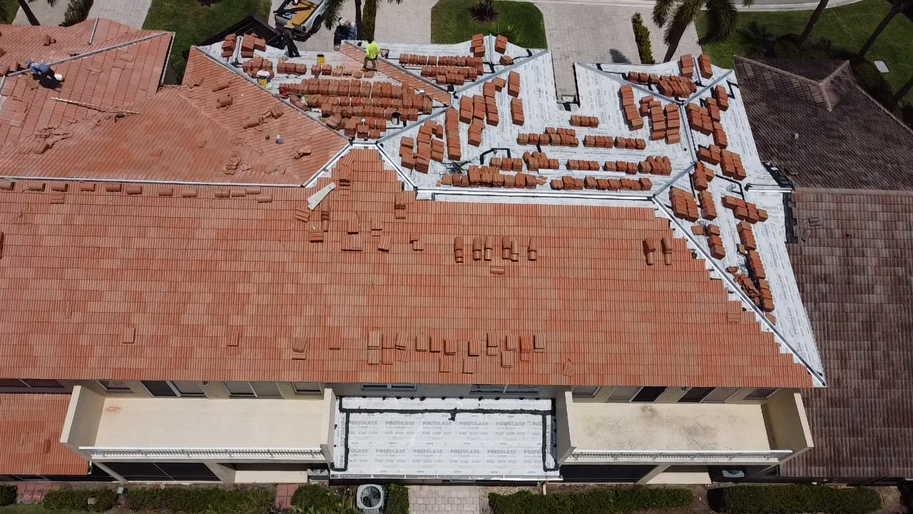 Tile staging on a large Florida roof during re-roof